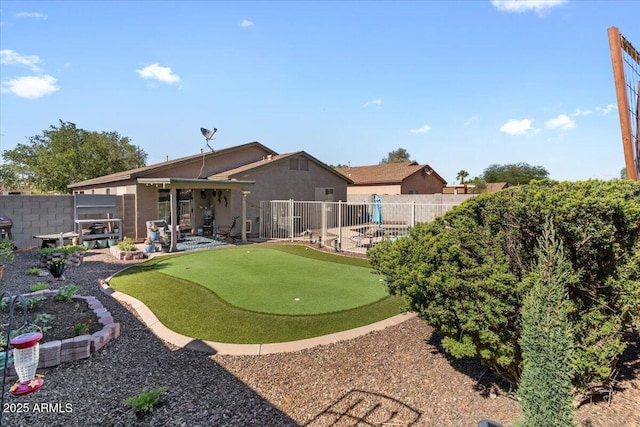 1057 E Silversmith Trl, San Tan Valley, AZ 85143 - view of yard featuring a putting green and a patio