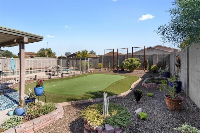 1057 E Silversmith Trl, San Tan Valley, AZ 85143 - fenced backyard with a putting area