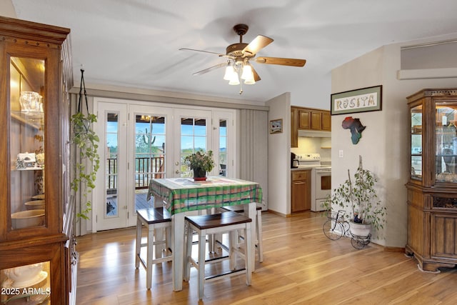 dining room featuring light wood-type flooring and a ceiling fan