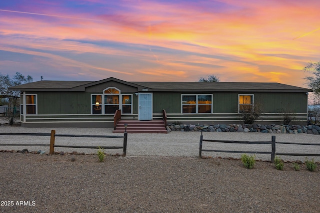 manufactured / mobile home with a fenced front yard