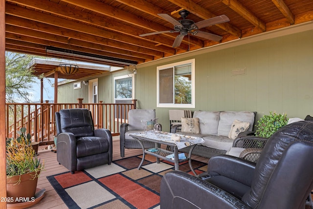 exterior space featuring an outdoor living space and a wooden deck