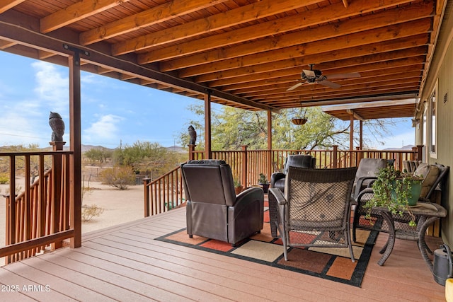 wooden terrace featuring ceiling fan