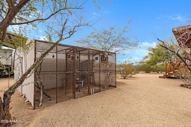 view of yard featuring an outdoor structure and exterior structure