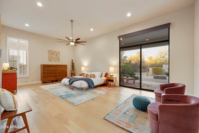 bedroom with ceiling fan, light hardwood / wood-style floors, and access to exterior