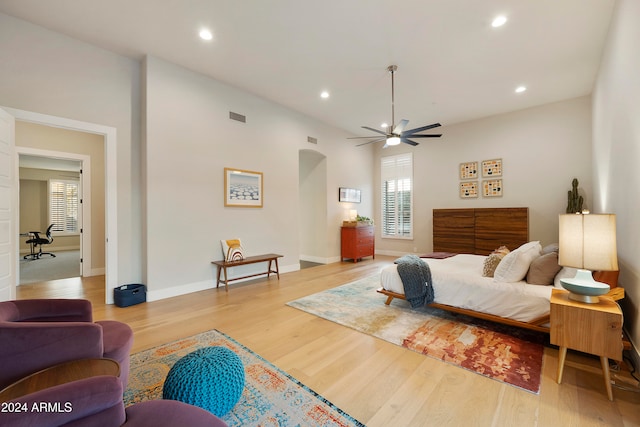 bedroom with ceiling fan and light hardwood / wood-style floors