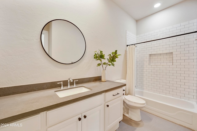 full bathroom with shower / tub combo with curtain, vanity, toilet, and tile patterned floors