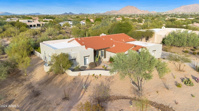 birds eye view of property featuring a mountain view