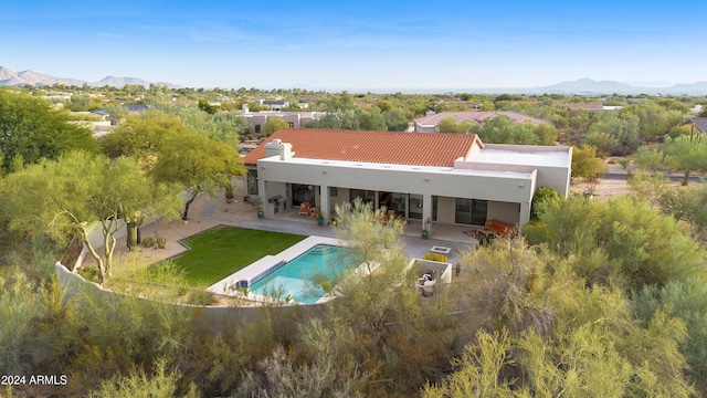 exterior space with a patio area and a mountain view