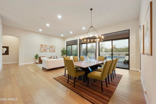 dining room featuring an inviting chandelier and light hardwood / wood-style floors