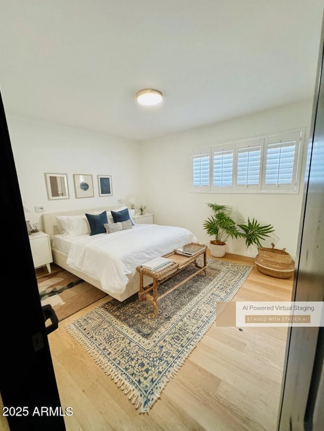 bedroom featuring wood finished floors