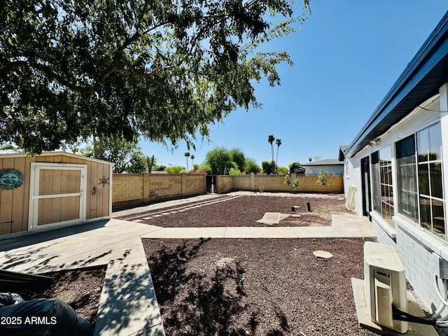 fenced backyard with a shed and an outdoor structure