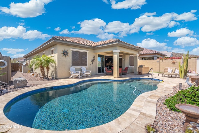view of swimming pool with a fenced in pool, a fenced backyard, and a patio area