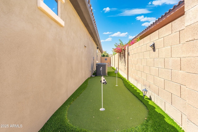 view of home's community with a fenced backyard