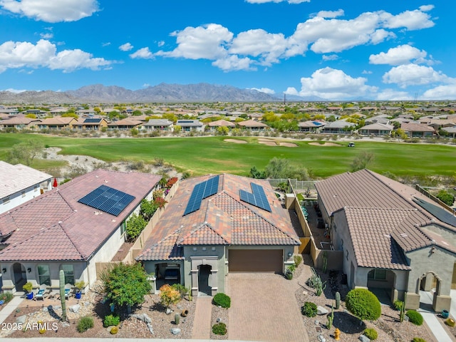 aerial view featuring view of golf course, a mountain view, and a residential view