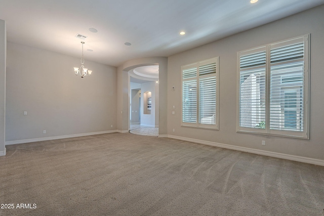 unfurnished room featuring visible vents, recessed lighting, an inviting chandelier, carpet flooring, and baseboards