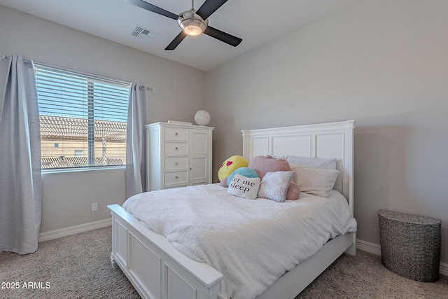 bedroom with visible vents, baseboards, light colored carpet, and ceiling fan