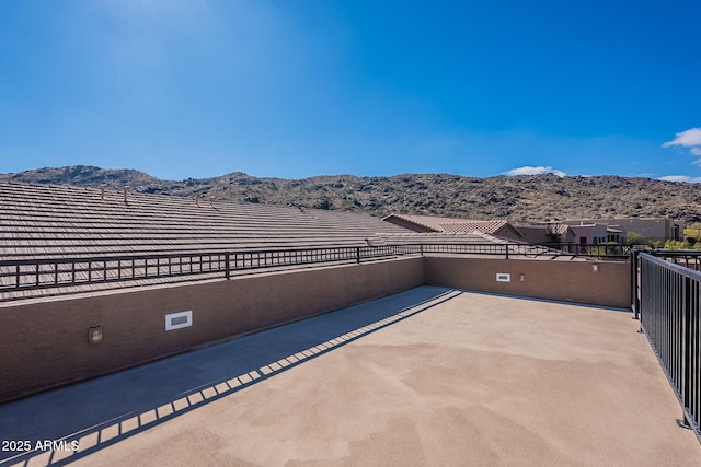 view of patio / terrace featuring a mountain view