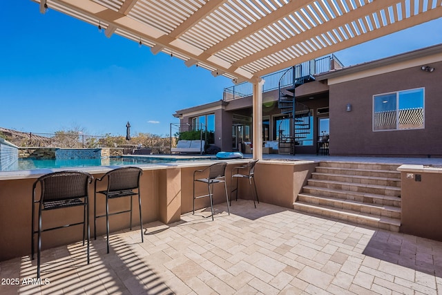 view of patio with outdoor dry bar, a pergola, and stairs