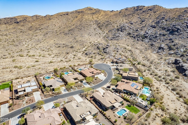 birds eye view of property with a mountain view and a residential view