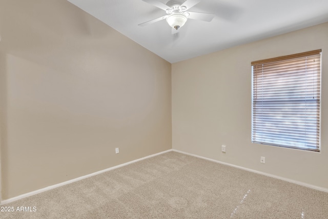 empty room featuring vaulted ceiling, carpet, and ceiling fan