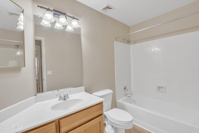 full bathroom with shower / tub combination, vanity, and toilet