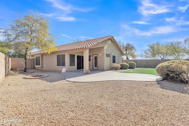 back of property with a patio area