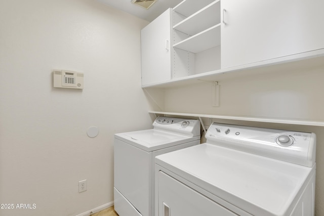 washroom with washing machine and clothes dryer