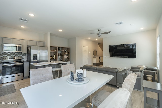 dining space with ceiling fan