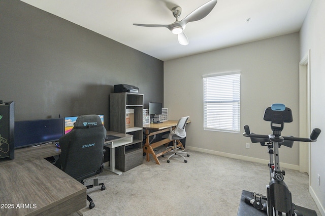 home office featuring ceiling fan and light carpet