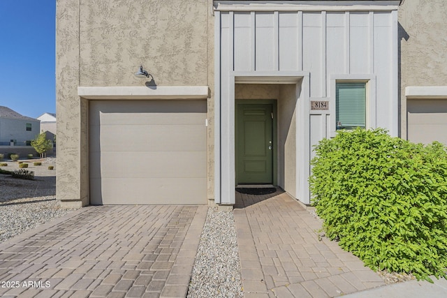 doorway to property featuring a garage