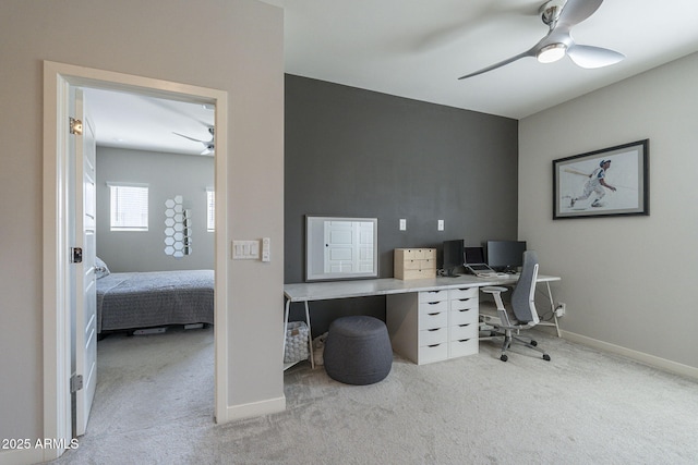 home office featuring ceiling fan and light carpet