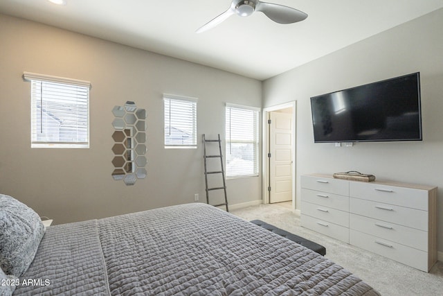 bedroom with ceiling fan and light colored carpet