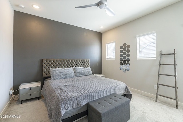 bedroom with ceiling fan and light colored carpet