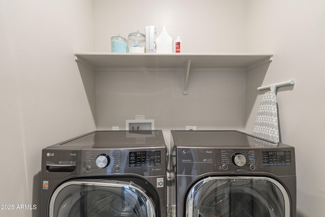 washroom featuring washing machine and dryer