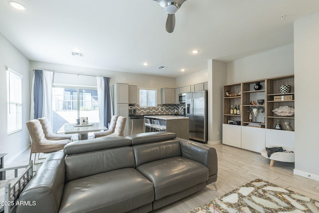 living room with ceiling fan