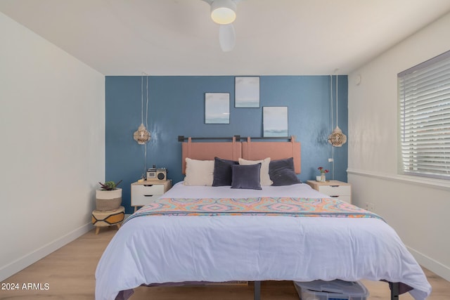 bedroom featuring ceiling fan and light hardwood / wood-style floors