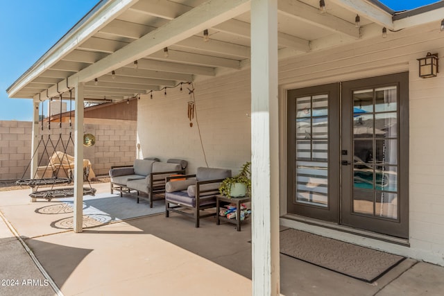 view of patio / terrace with an outdoor living space and french doors