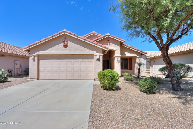 mediterranean / spanish-style home featuring a garage