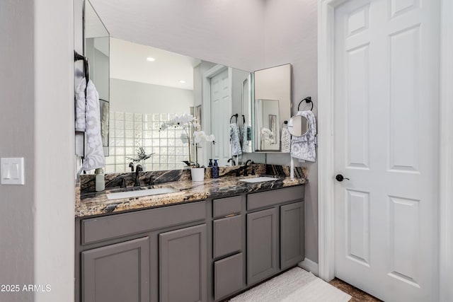 full bath with double vanity and a sink