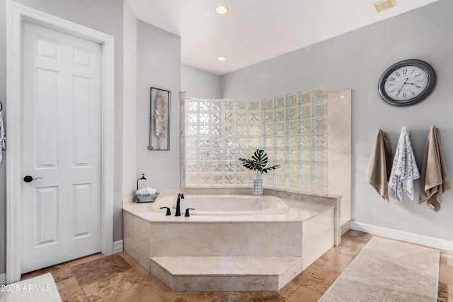 bathroom featuring recessed lighting, visible vents, a garden tub, and baseboards