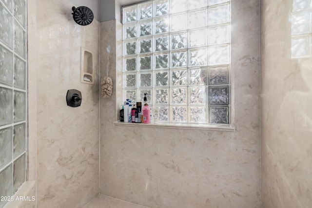 full bath featuring a tile shower