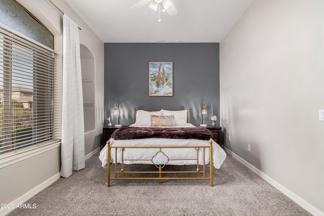 bedroom with carpet, baseboards, and a ceiling fan