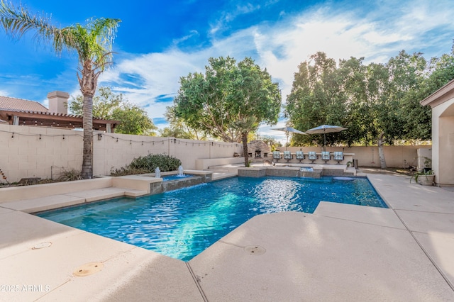 view of swimming pool with a patio, a fenced backyard, a fenced in pool, and an in ground hot tub