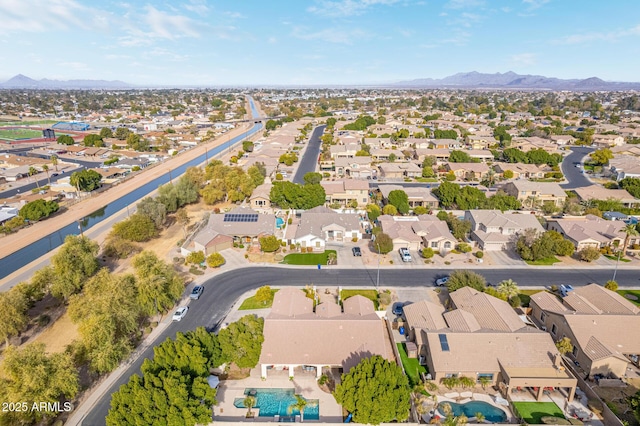 birds eye view of property with a residential view and a mountain view