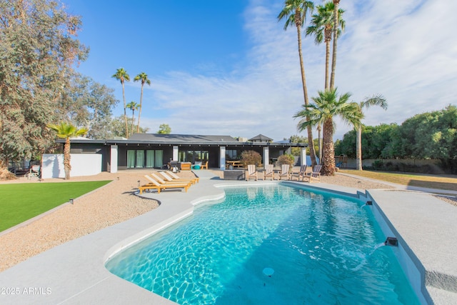 view of swimming pool with a patio area