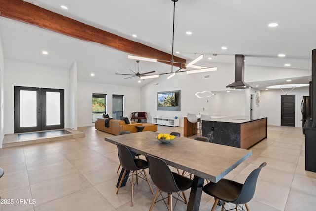 tiled dining space featuring french doors, ceiling fan, and lofted ceiling with beams