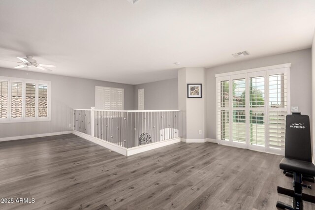 4142 E Sandy Way, Gilbert, AZ 85297 - unfurnished room featuring a ceiling fan, wood finished floors, and baseboards
