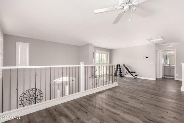 4142 E Sandy Way, Gilbert, AZ 85297 - empty room featuring wood finished floors, a ceiling fan, and baseboards