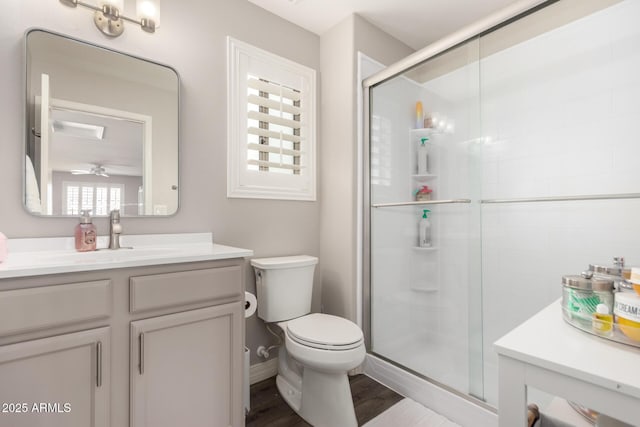 4142 E Sandy Way, Gilbert, AZ 85297 - full bathroom with a stall shower, vanity, toilet, and wood finished floors