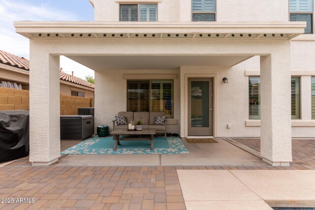 4142 E Sandy Way, Gilbert, AZ 85297 - back of property with a patio, an outdoor living space, stucco siding, and cooling unit